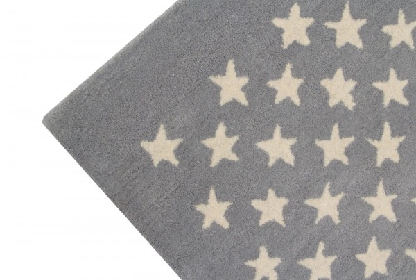 Lorena Canals Wollteppich Little Stars Light Grey mit blauen Sternen 140x200